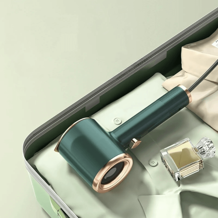 Uscător de rufe electric, montat într-o baie modernă cu finisaje elegante.